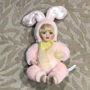 Vintage porcelain pink bunny doll.